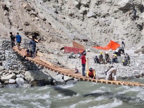 Local Residents Build Temporary Wooden Bridge in Aamachhodingmo, Demand Permanent Infrastructure